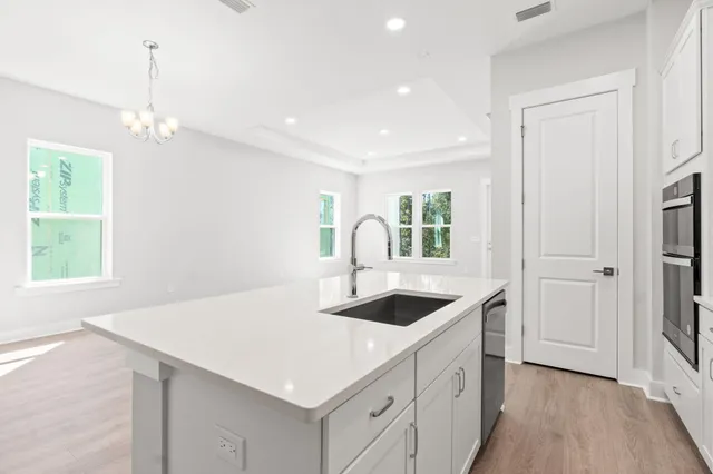 a kitchen with a stove and a sink