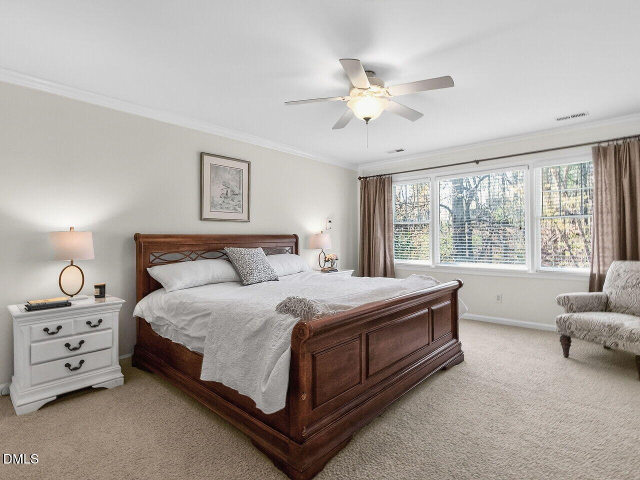 1917 Hamrick Drive Raleigh, NC 27615 - Photo 12 of 23 a bed room with a bed and a chandelier