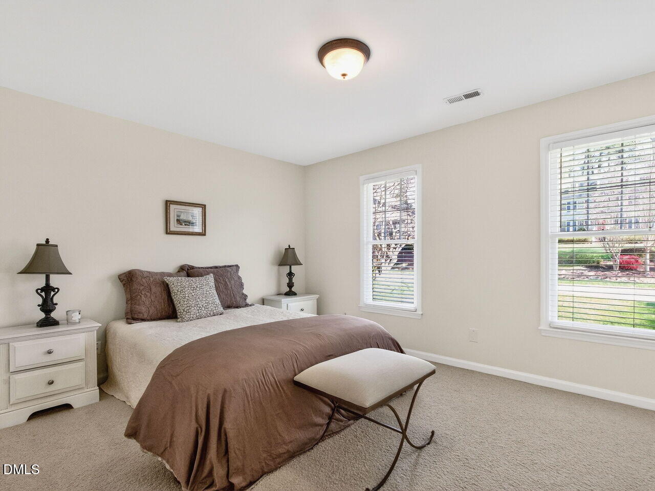 1917 Hamrick Drive Raleigh, NC 27615 - Photo 14 of 23 a bedroom with a bed and a window