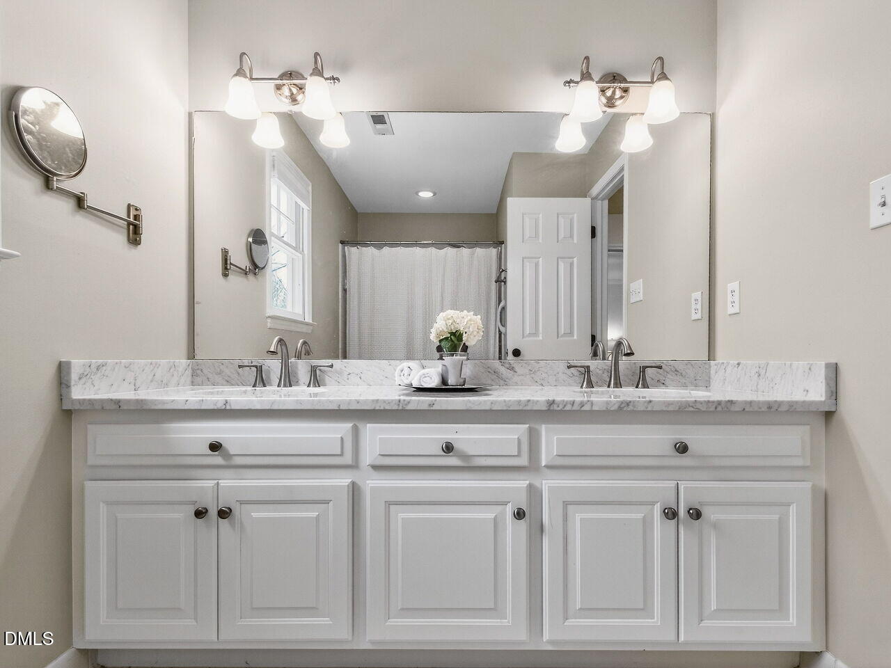 1917 Hamrick Drive Raleigh, NC 27615 - Photo 15 of 23 a bathroom with white cabinets and a sink