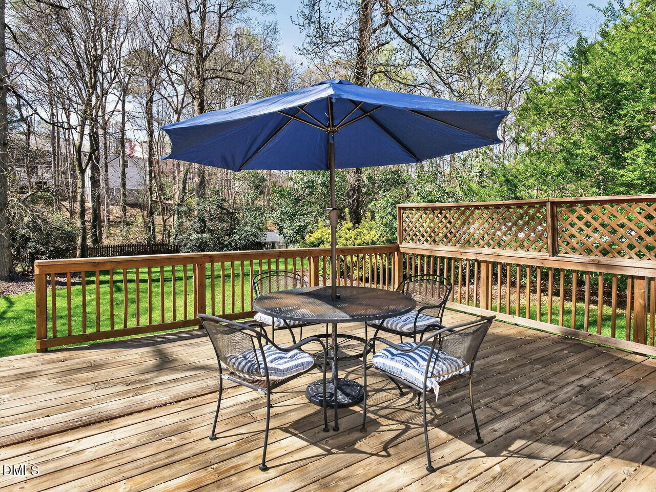 1917 Hamrick Drive Raleigh, NC 27615 - Photo 21 of 23 a view of a chairs and table on the wooden deck