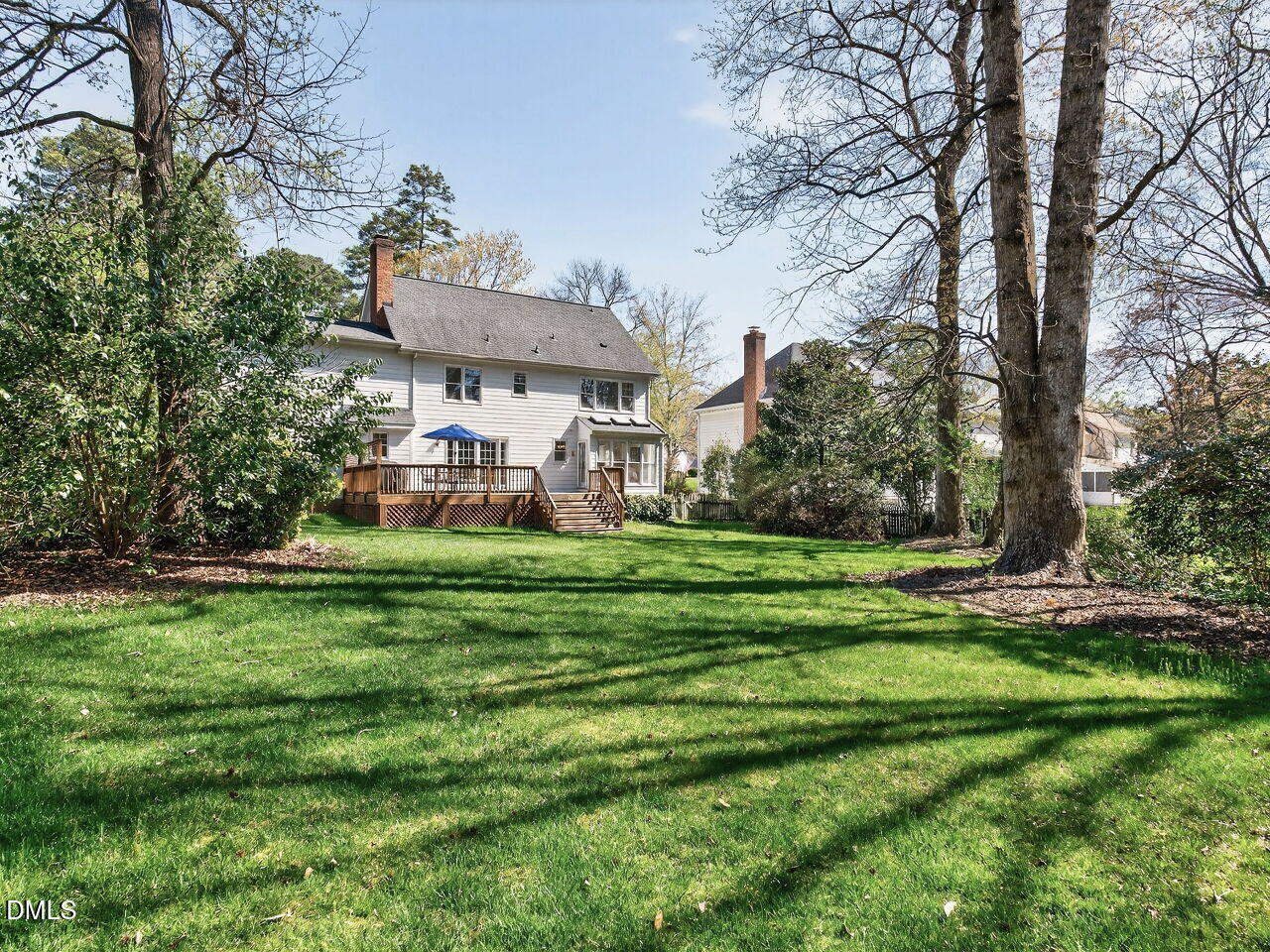 1917 Hamrick Drive Raleigh, NC 27615 - Photo 23 of 23 a view of a big house with a big yard and large trees