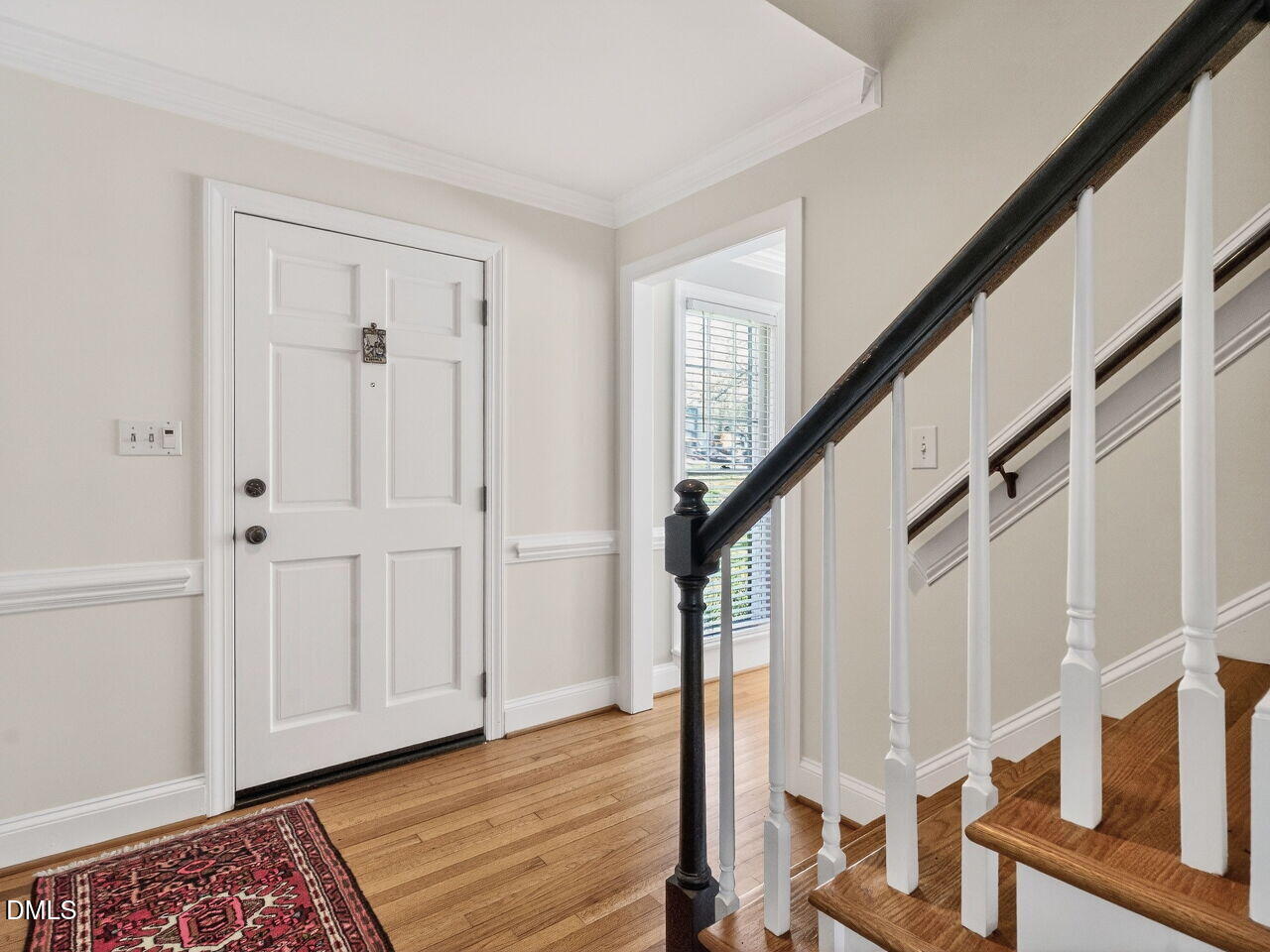 1917 Hamrick Drive Raleigh, NC 27615 - Photo 3 of 23 a view of entryway with wooden floor and stairs