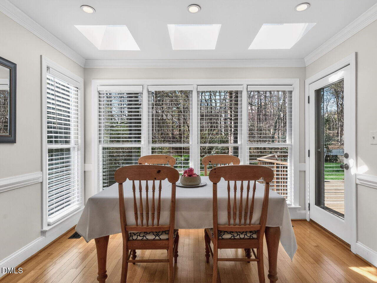 1917 Hamrick Drive Raleigh, NC 27615 - Photo 6 of 23 a view of a dining room with furniture and wooden floor