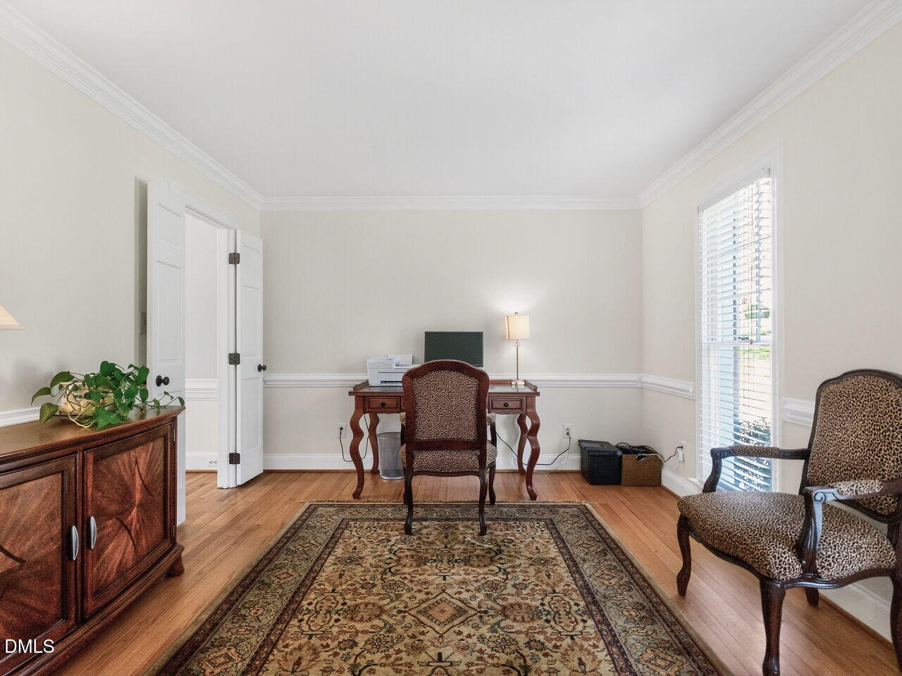 1917 Hamrick Drive Raleigh, NC 27615 - Photo 7 of 23 a living room with furniture and wooden floor