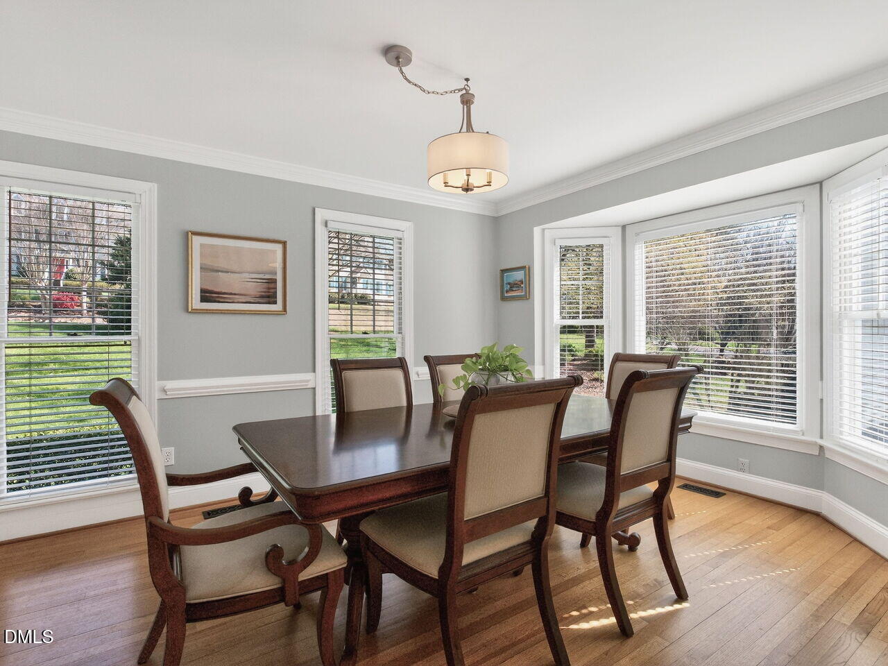 1917 Hamrick Drive Raleigh, NC 27615 - Photo 9 of 23 a view of a dining room with furniture window and wooden floor