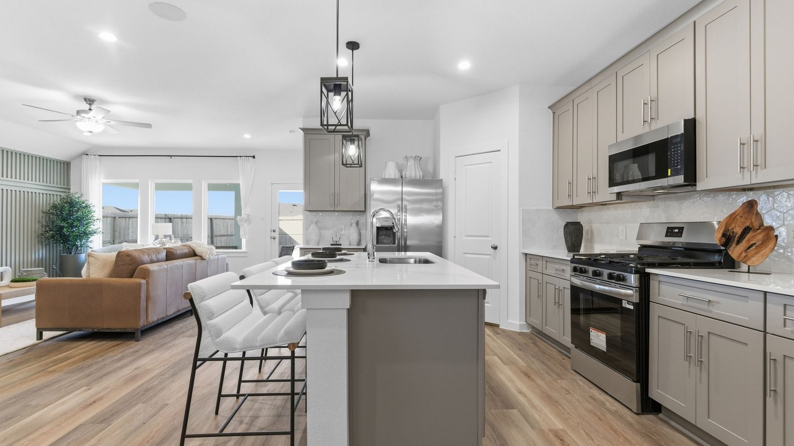 3229 Bolt Rope Drive Texas City, TX 77510 - Photo 4 of 20 a kitchen with stainless steel appliances granite countertop a sink and stove top oven