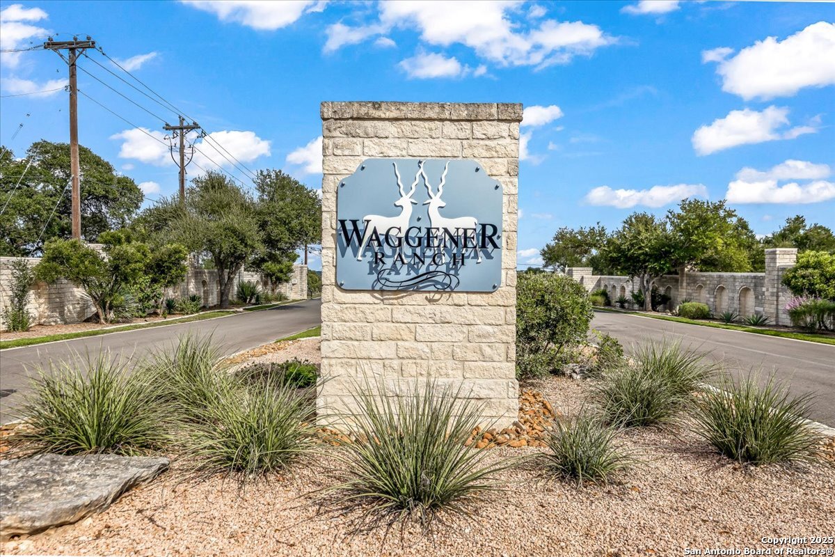 1059 Ranger Ridge New Braunfels, TX 78132 - Photo 17 of 23 a view of a street with flower plants and wooden fence