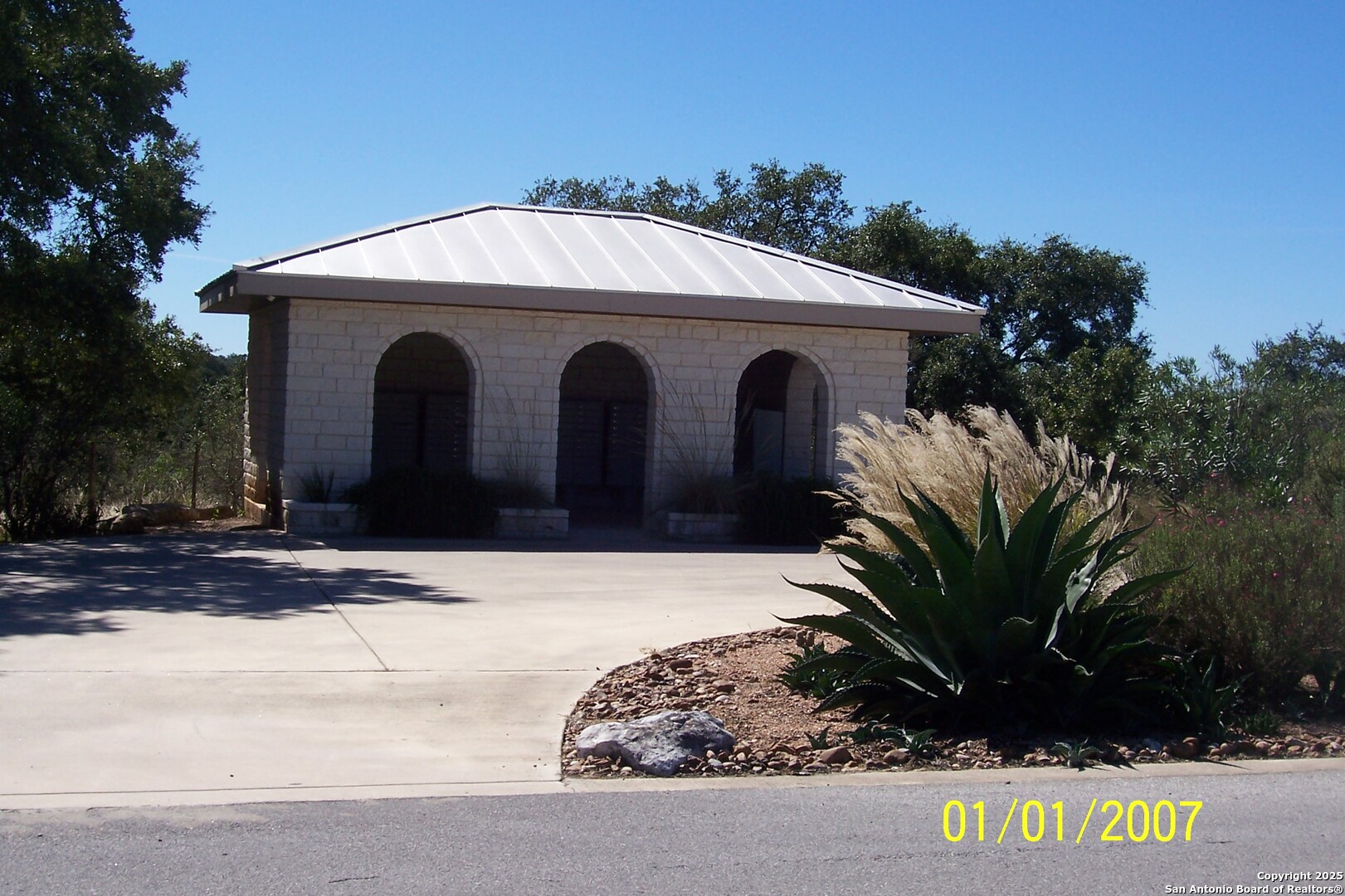 1059 Ranger Ridge New Braunfels, TX 78132 - Photo 21 of 23 a view of a house with a yard and garage