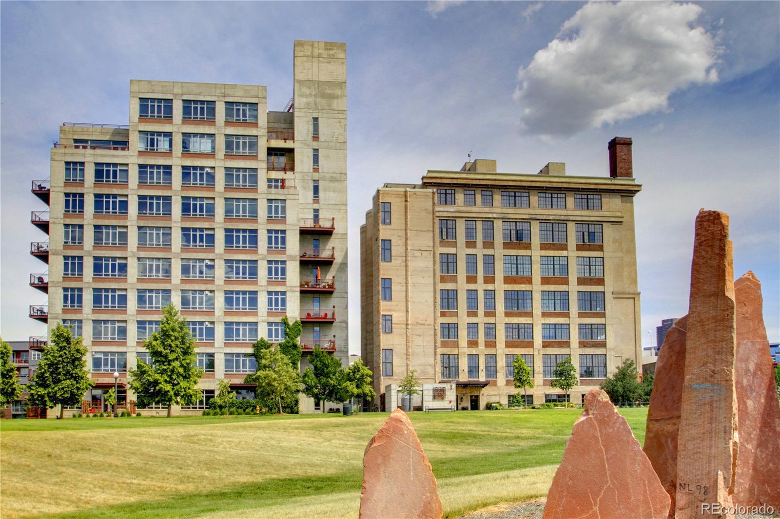 2000 Little Raven Street, Unit 102 Denver, CO 80202 - Photo 2 of 36 a front view of a building with a garden and plants
