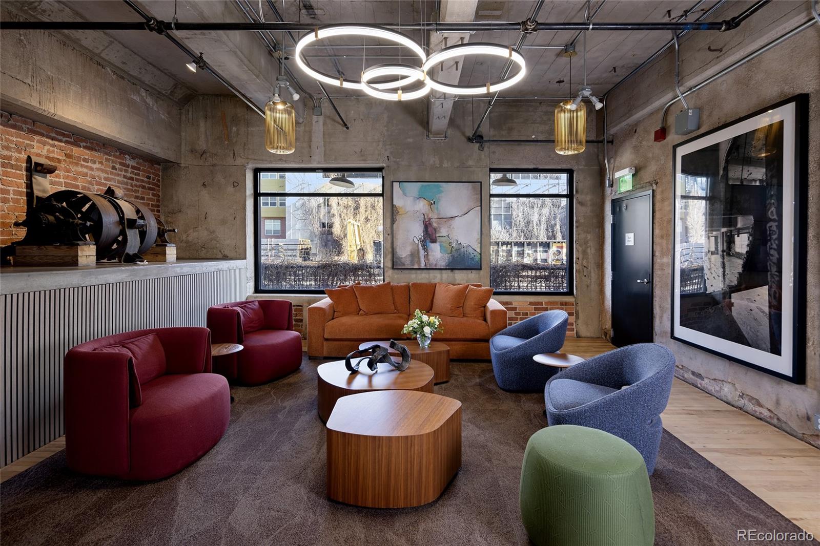 2000 Little Raven Street, Unit 102 Denver, CO 80202 - Photo 26 of 36 a living room with furniture and a large window