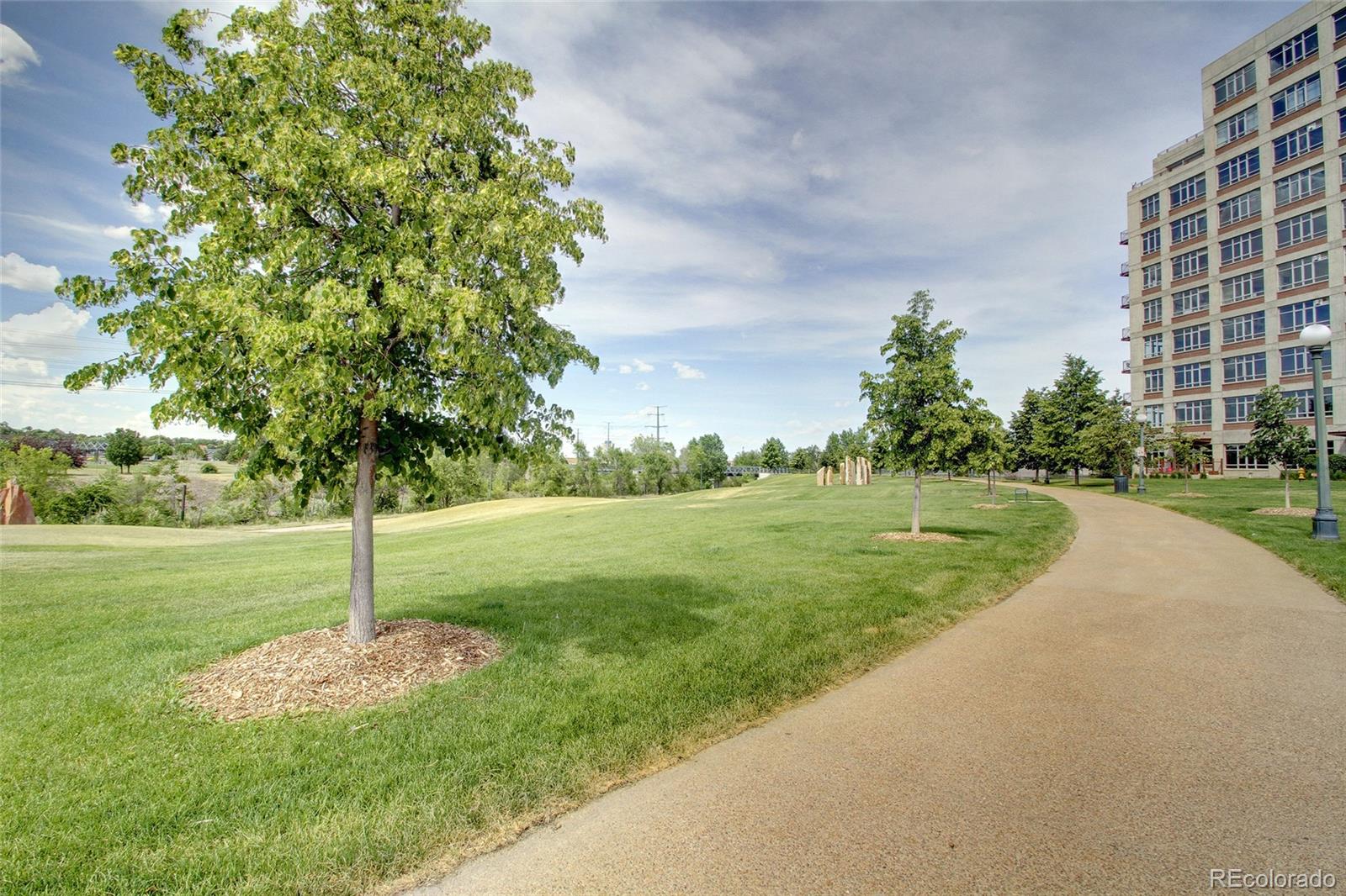 2000 Little Raven Street, Unit 102 Denver, CO 80202 - Photo 28 of 36 a view of a house with a yard
