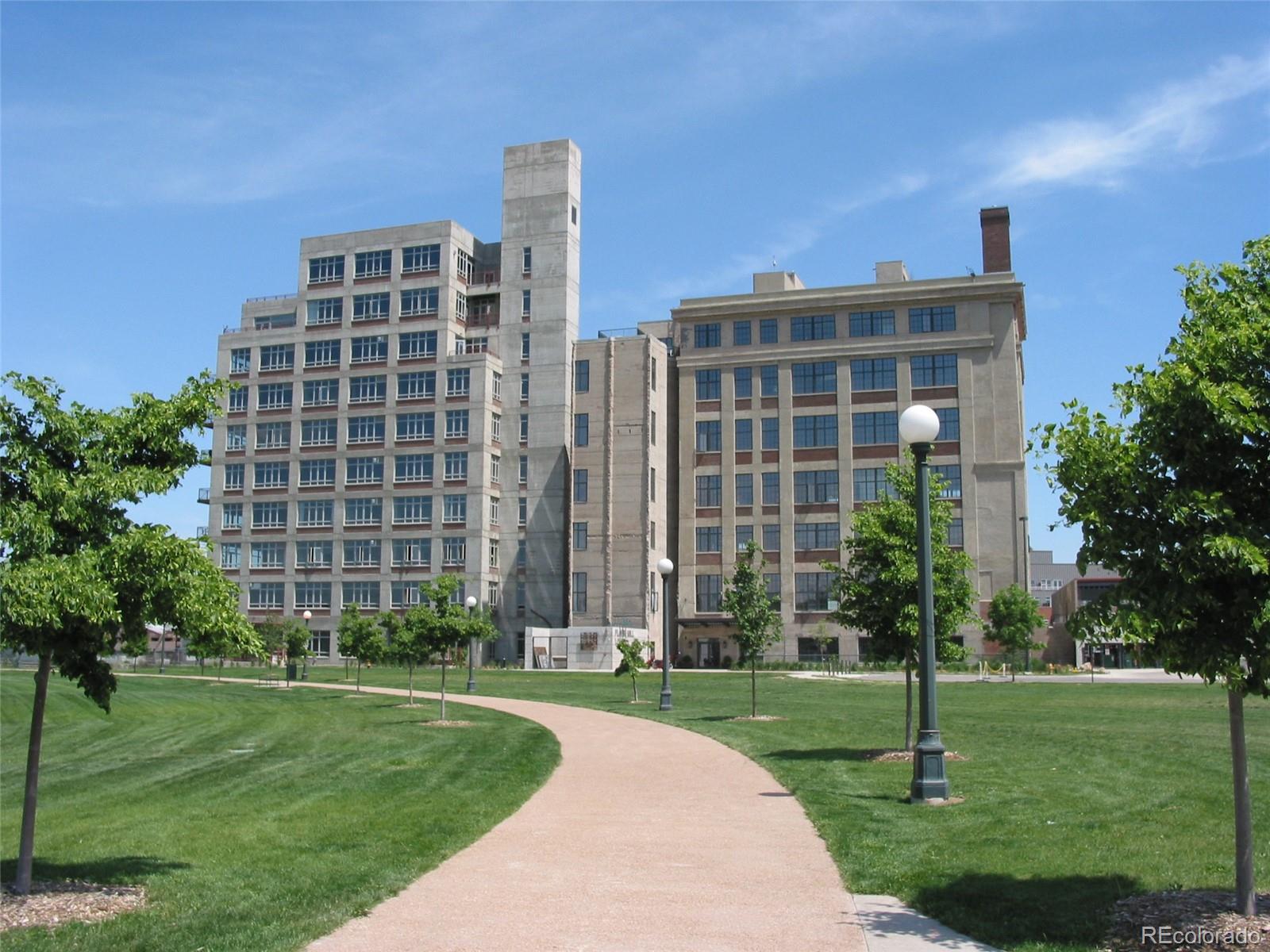 2000 Little Raven Street, Unit 102 Denver, CO 80202 - Photo 31 of 36 a front view of a building with a garden