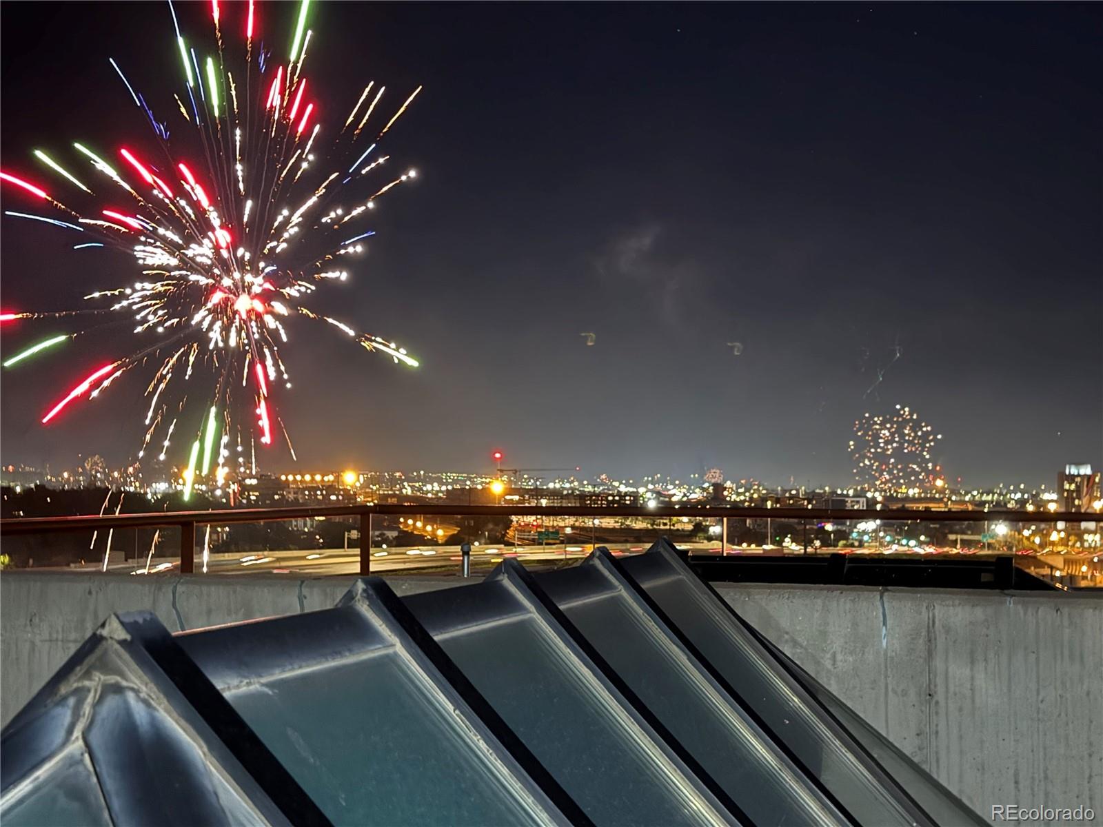 2000 Little Raven Street, Unit 102 Denver, CO 80202 - Photo 32 of 36 a view of a lake from a balcony