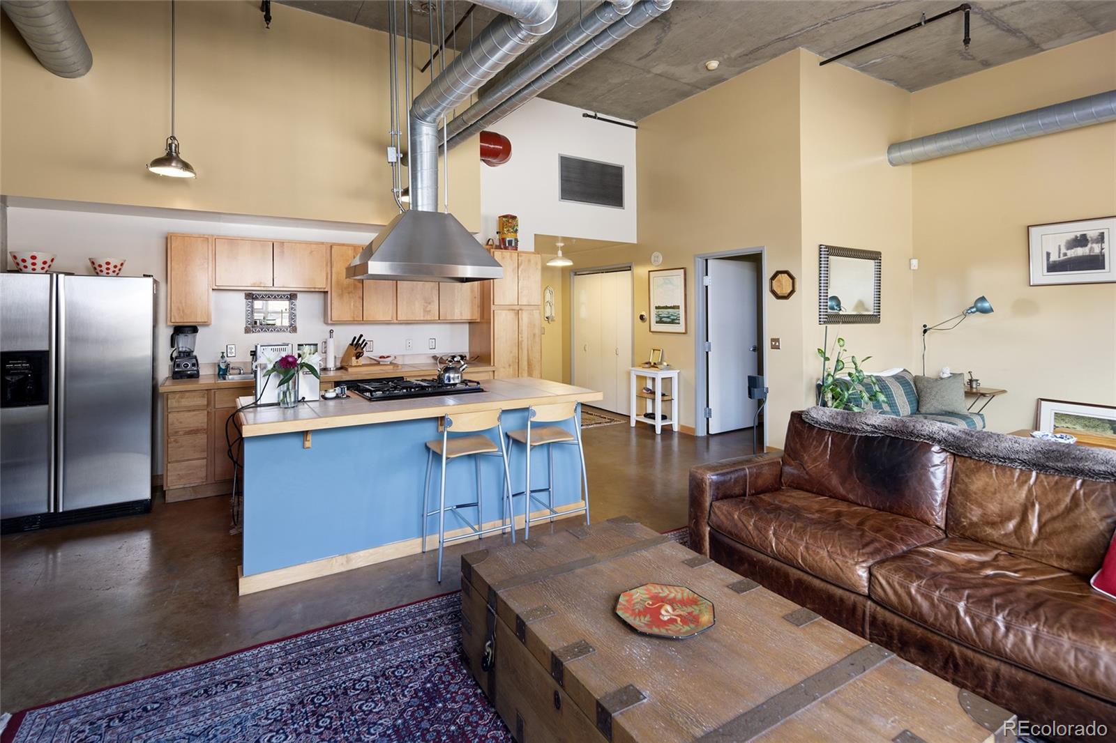 2000 Little Raven Street, Unit 102 Denver, CO 80202 - Photo 8 of 36 a living room with furniture and wooden floor