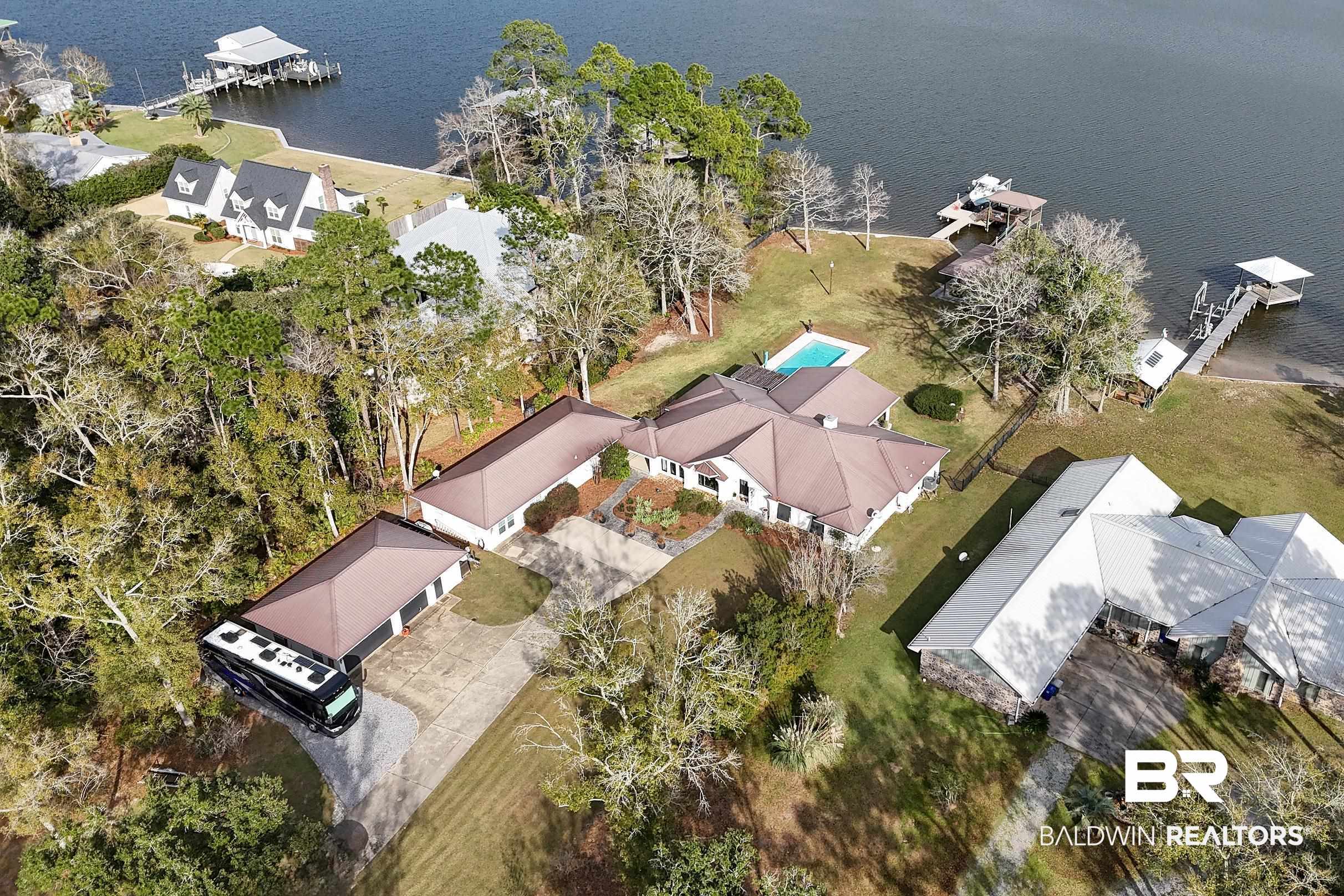 8490 Bay View Drive Foley, AL 36535 - Photo 65 of 67 Aerial perspective of suburban area with a nearby body of water