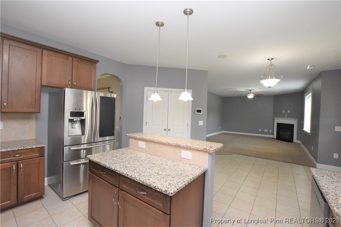 94 Revolutionary Road Cameron, NC 28326 - Photo 11 of 31 a kitchen with kitchen island a counter top space a sink appliances and cabinets