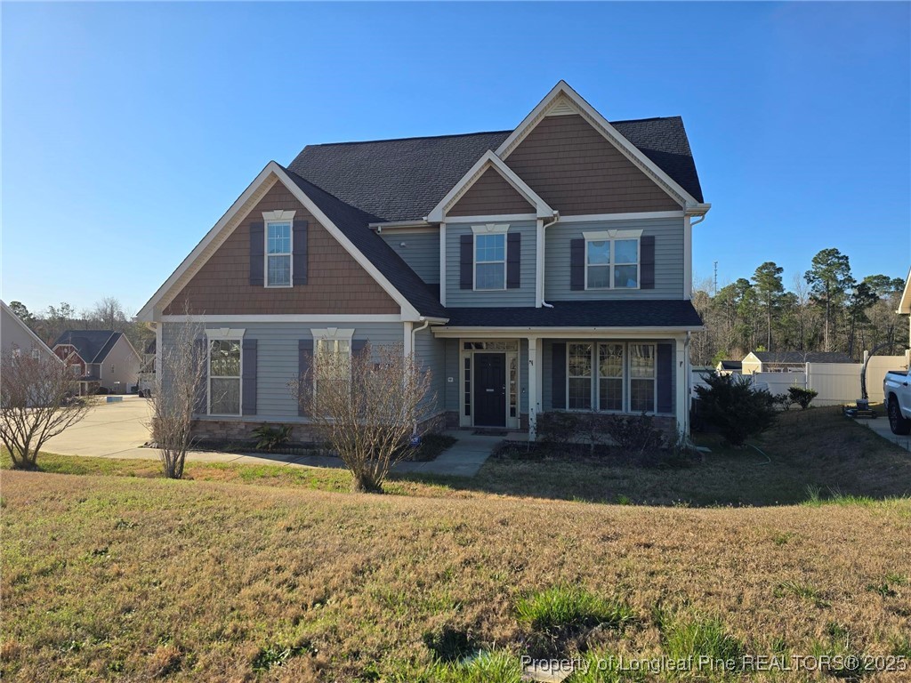 94 Revolutionary Road Cameron, NC 28326 - Photo 3 of 31 a front view of a house with a yard