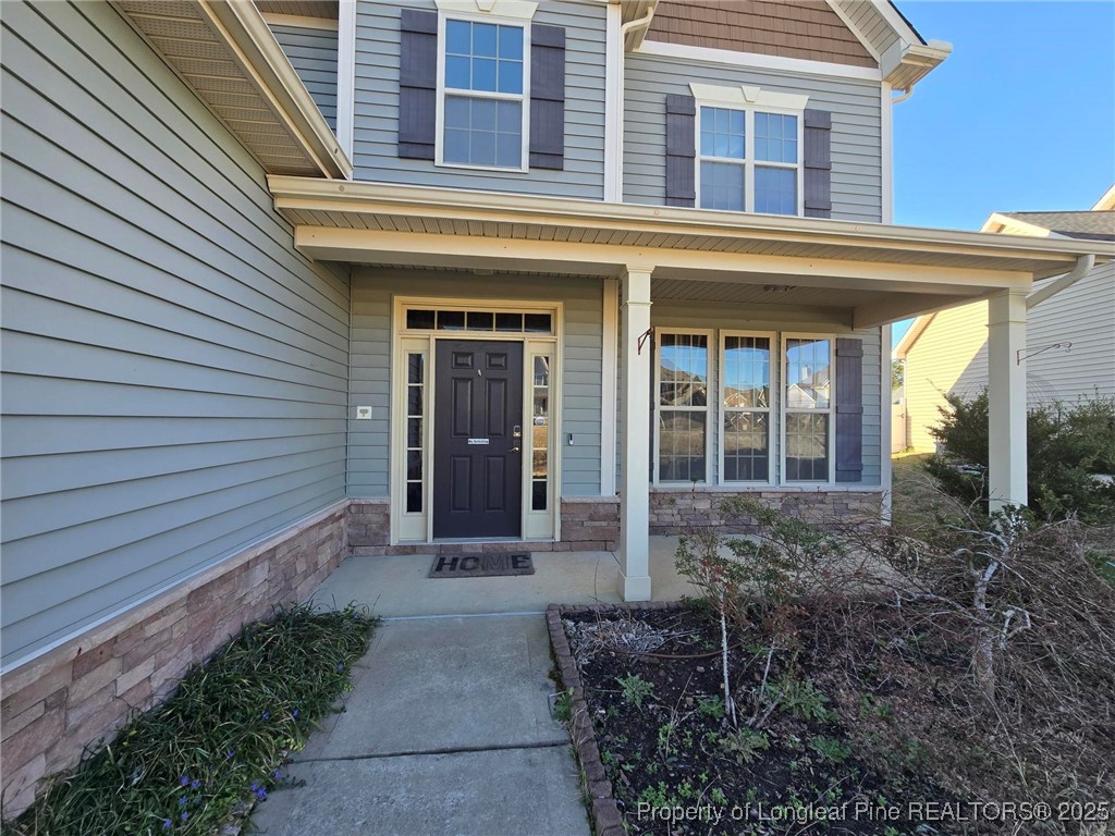 94 Revolutionary Road Cameron, NC 28326 - Photo 6 of 31 a front view of a house with garden