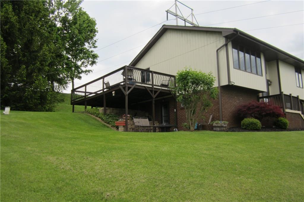 158 Craft Washington, PA 15301 - Photo 2 of 25 Side view of home showing part of the wrap-around deck.