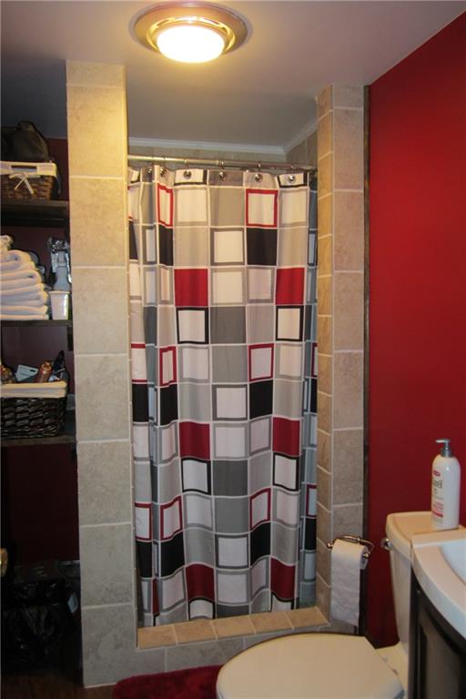 158 Craft Washington, PA 15301 - Photo 16 of 25 Lower level bath showing ceramic shower and built-in shelving.