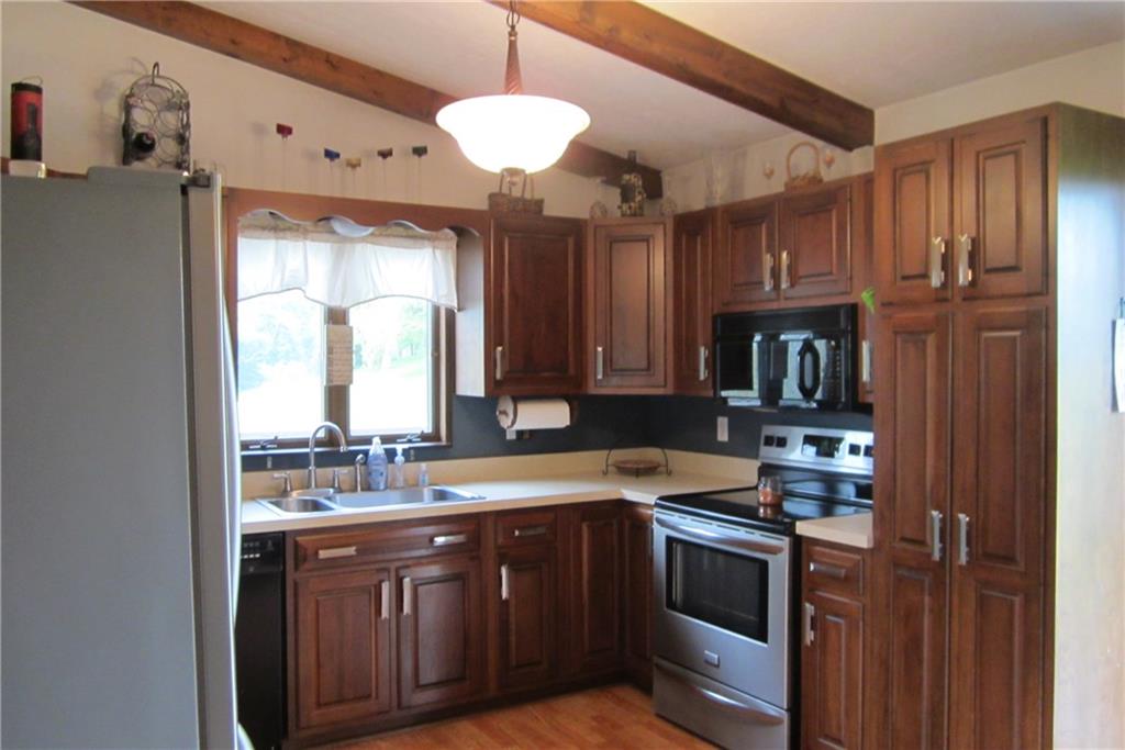 158 Craft Washington, PA 15301 - Photo 4 of 25 The spacious kitchen has dark wood cabinetry. Appliances are included with the sale. Note the large pantry.