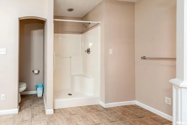 a bathroom with a glass shower door