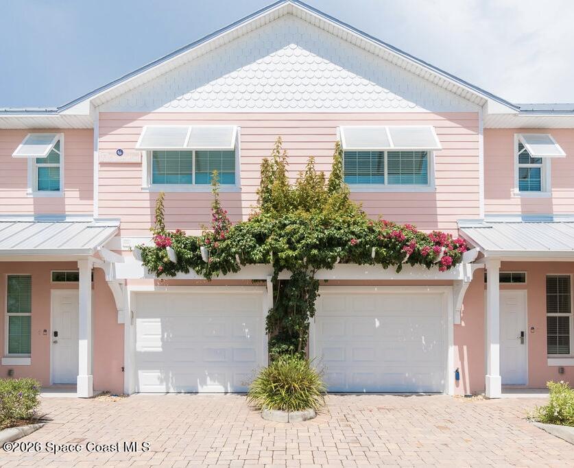 2709 Cutlass Point Lane, Unit 103 Merritt Island, FL 32953 - Photo 1 of 31 a front view of a house with a yard