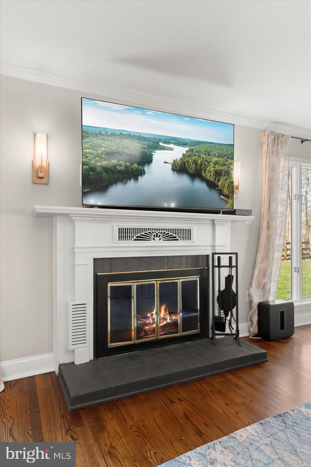 2102 Highland Ridge Drive Phoenix, MD 21131 - Photo 11 of 95 a living room with a fireplace and a floor to ceiling window