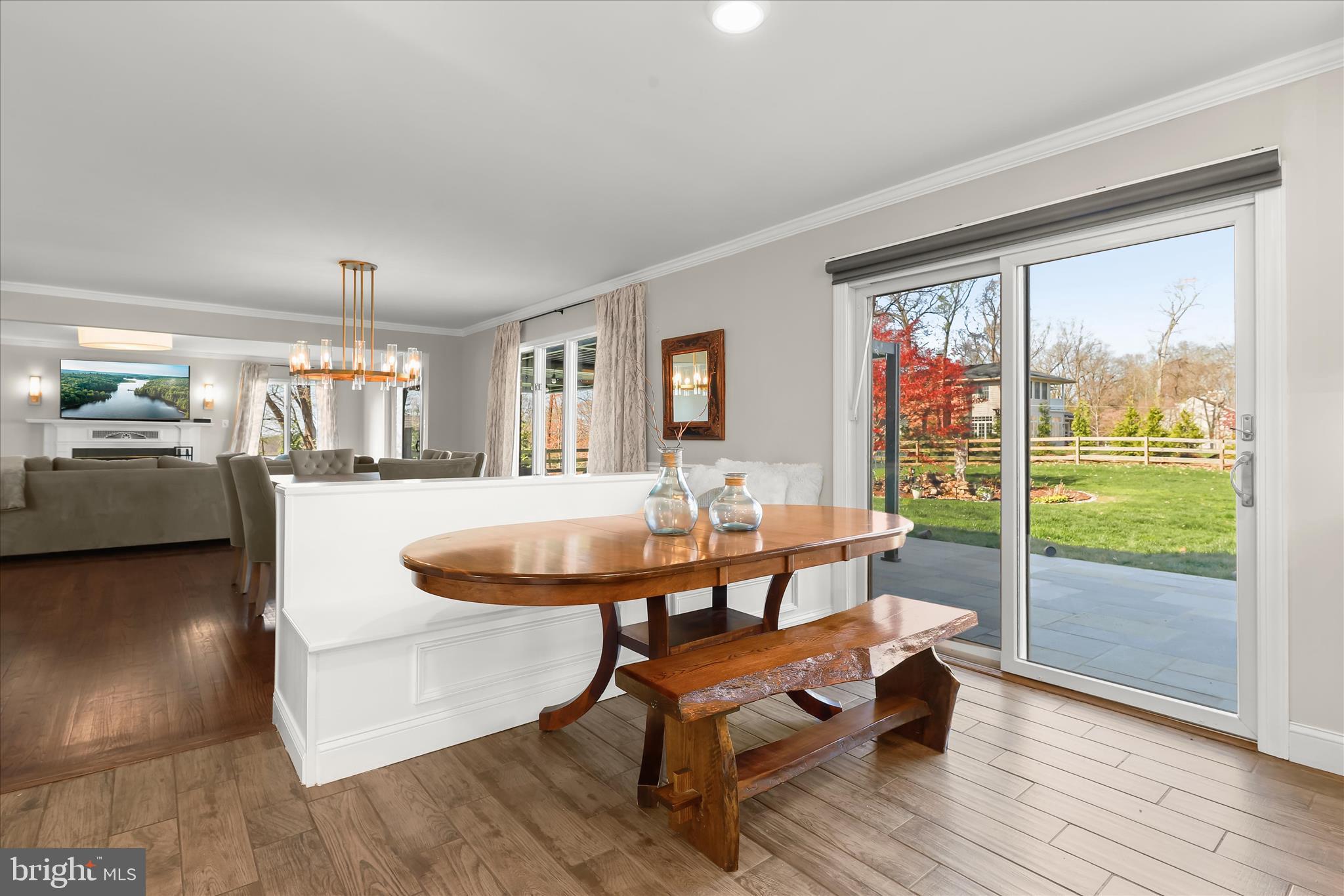 2102 Highland Ridge Drive Phoenix, MD 21131 - Photo 16 of 95 a dining room with wooden floor and a floor to ceiling window
