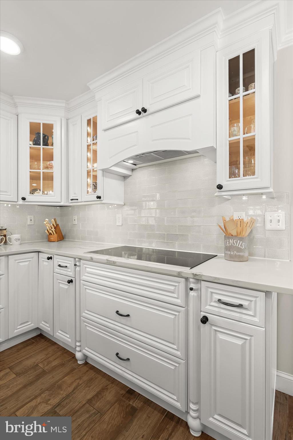 2102 Highland Ridge Drive Phoenix, MD 21131 - Photo 23 of 95 a kitchen with granite countertop white cabinets and window