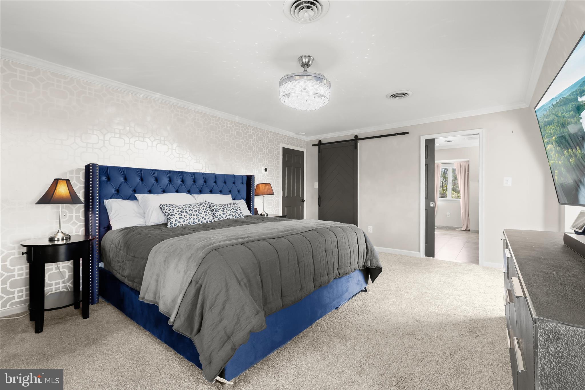2102 Highland Ridge Drive Phoenix, MD 21131 - Photo 42 of 95 a bedroom with a bed and a chandelier