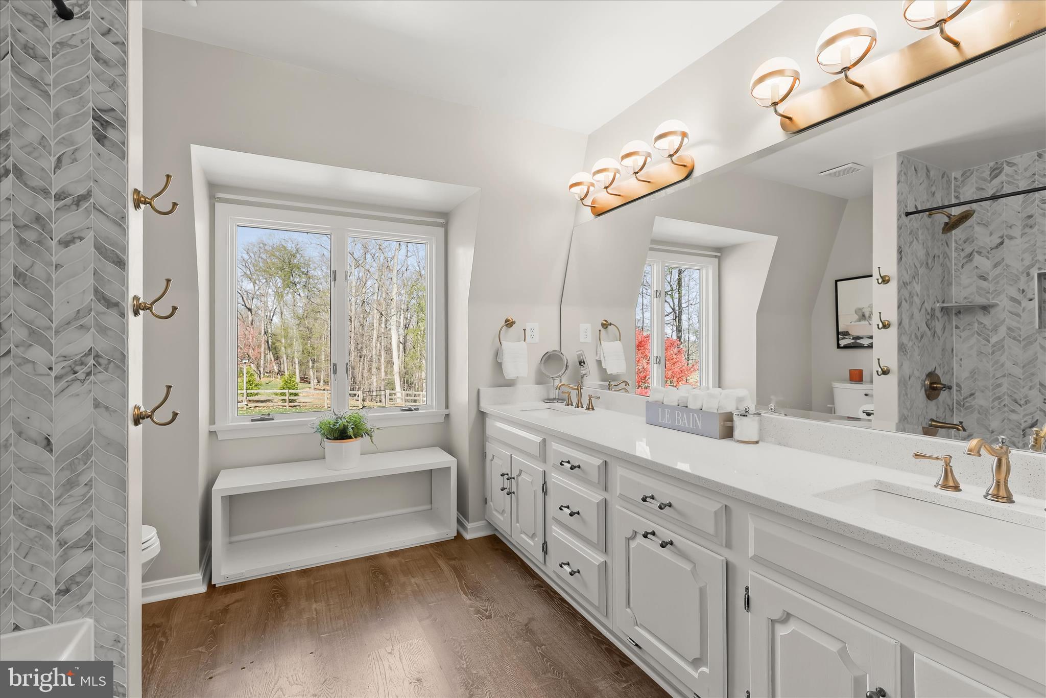 2102 Highland Ridge Drive Phoenix, MD 21131 - Photo 53 of 95 a spacious bathroom with a double vanity sink a large mirror a bathtub and next to a window