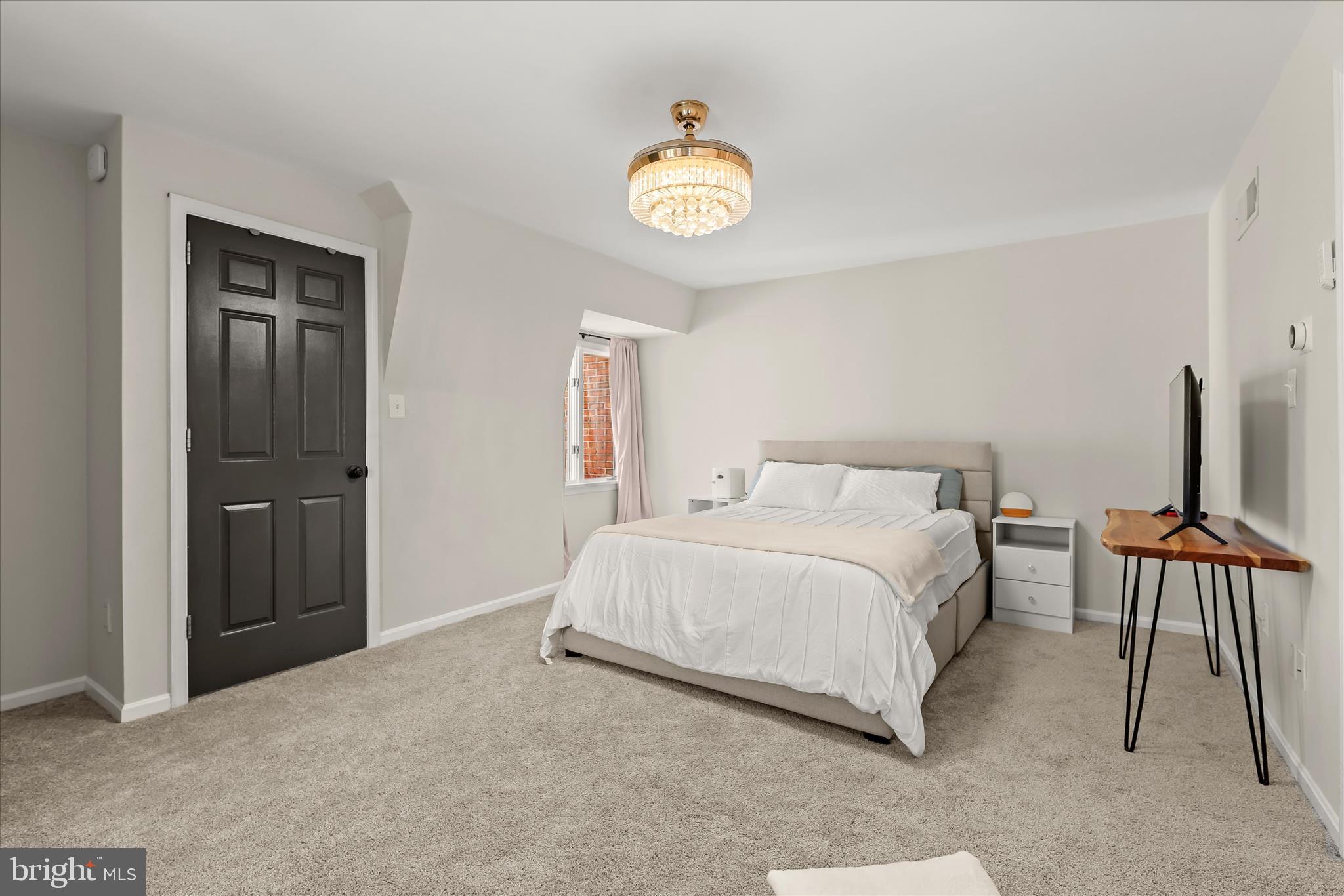2102 Highland Ridge Drive Phoenix, MD 21131 - Photo 55 of 95 a spacious bedroom with a bed and a lamp on table