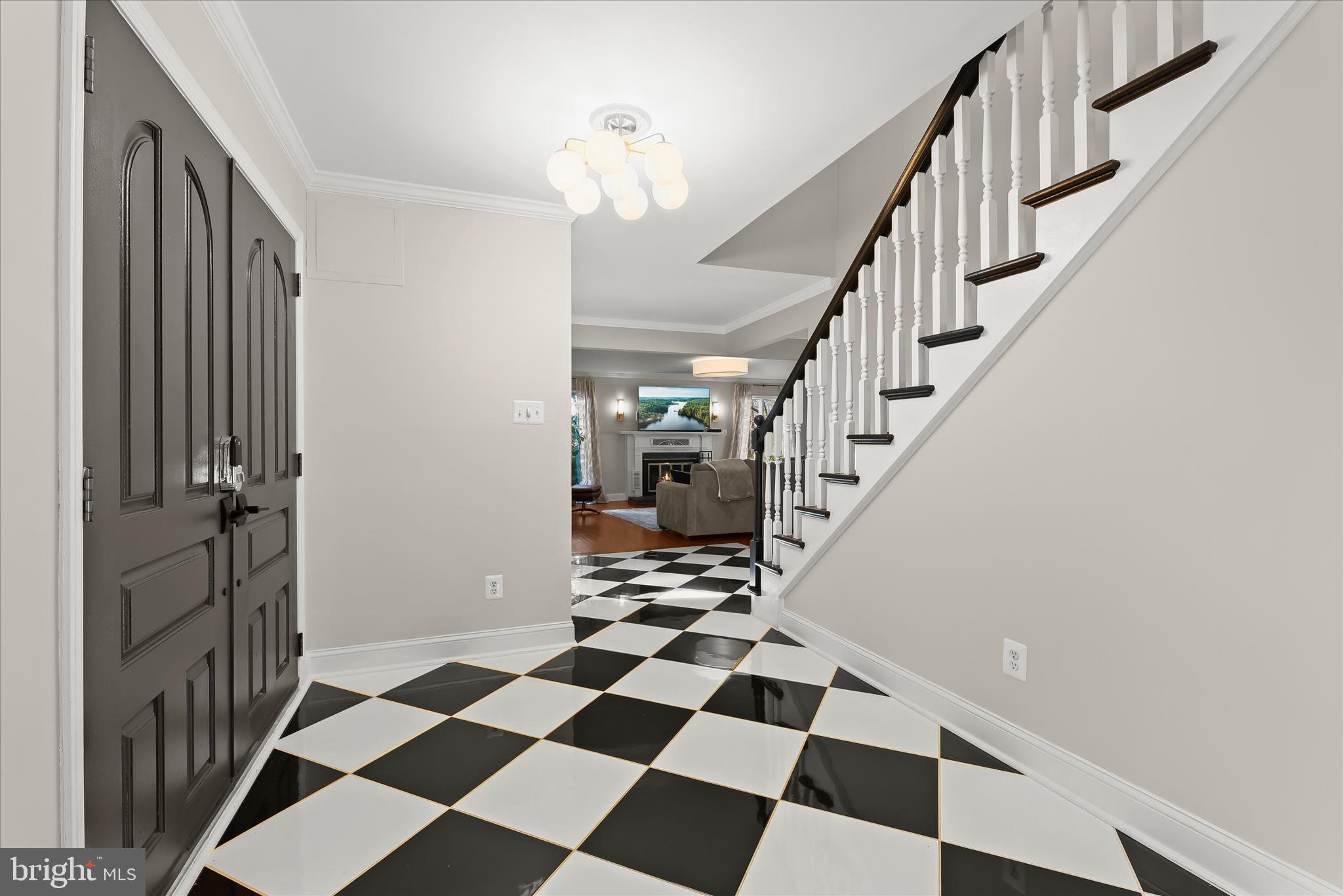 2102 Highland Ridge Drive Phoenix, MD 21131 - Photo 6 of 95 a view of a hallway with a black and white checkered floor