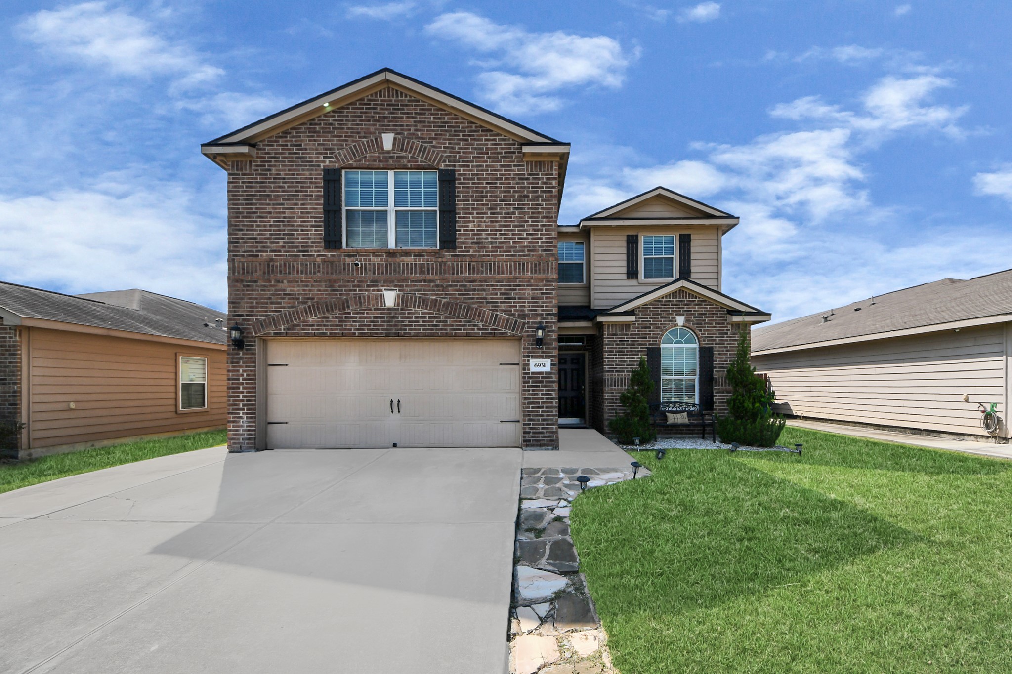6931 Primrose Road Baytown, TX 77521 - Photo 2 of 50 a front view of a house with yard and green space