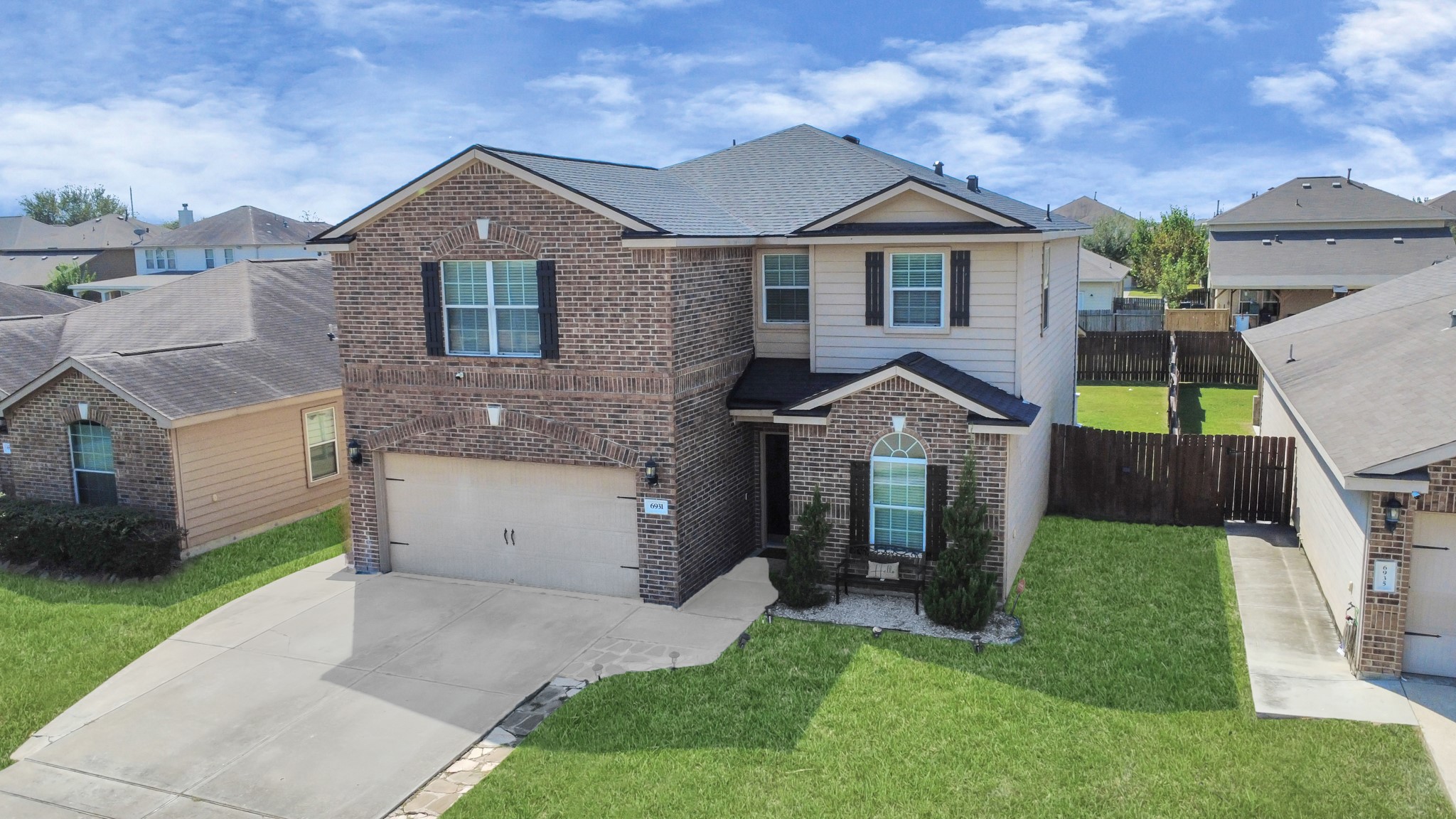 6931 Primrose Road Baytown, TX 77521 - Photo 3 of 50 a front view of a house with a yard and garage