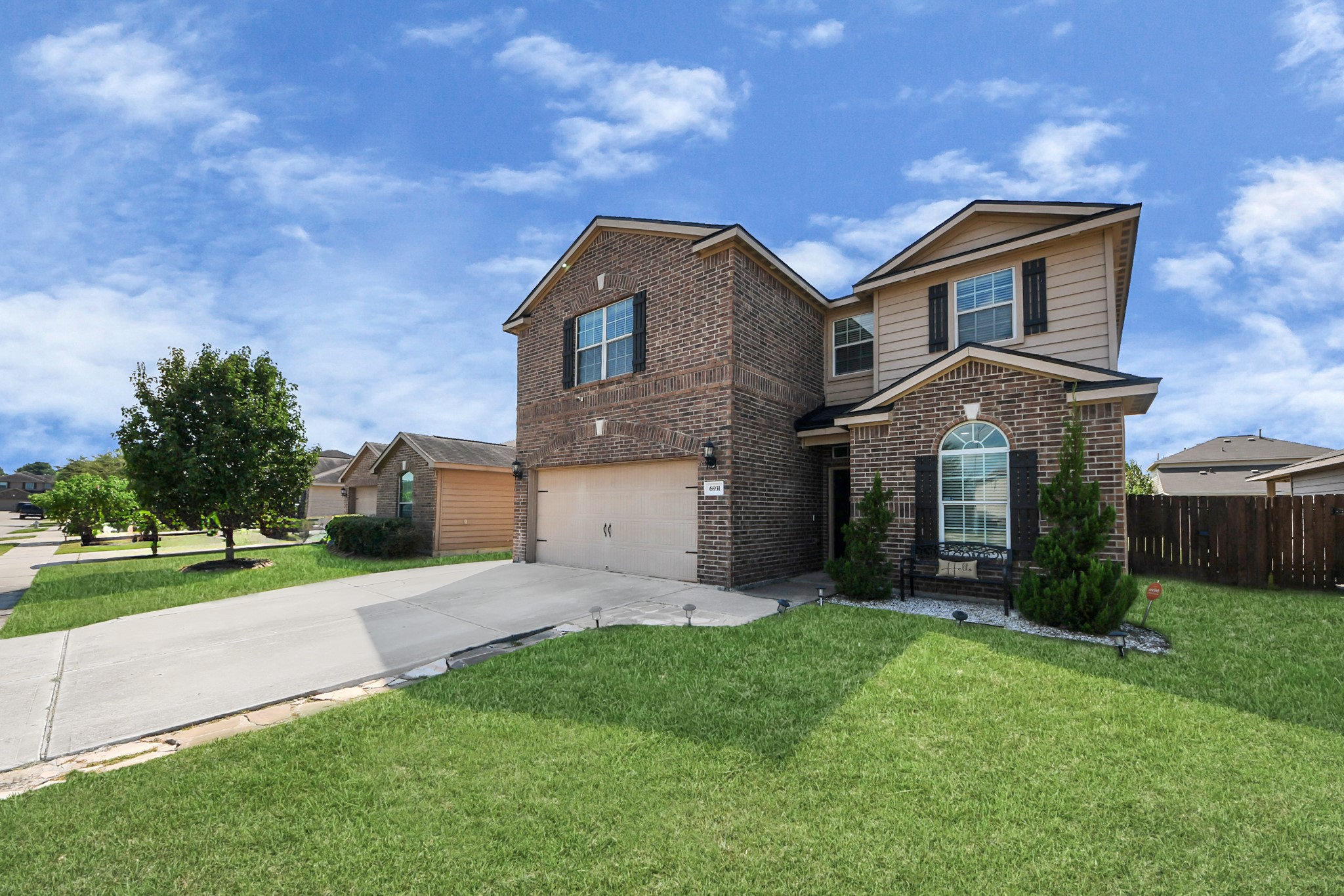 6931 Primrose Road Baytown, TX 77521 - Photo 4 of 50 a front view of a house with a yard and garage
