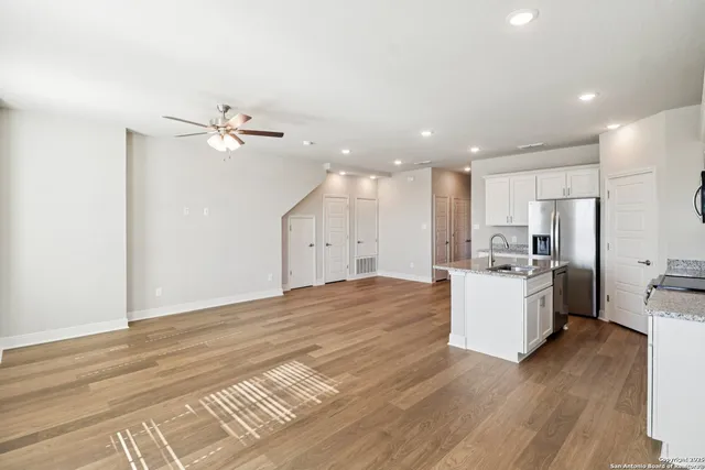 a view of kitchen with furniture and refrigerator