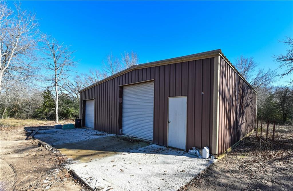 12200 Winn Road Franklin, TX 77856 - Photo 20 of 33 a view of backyard with cabin