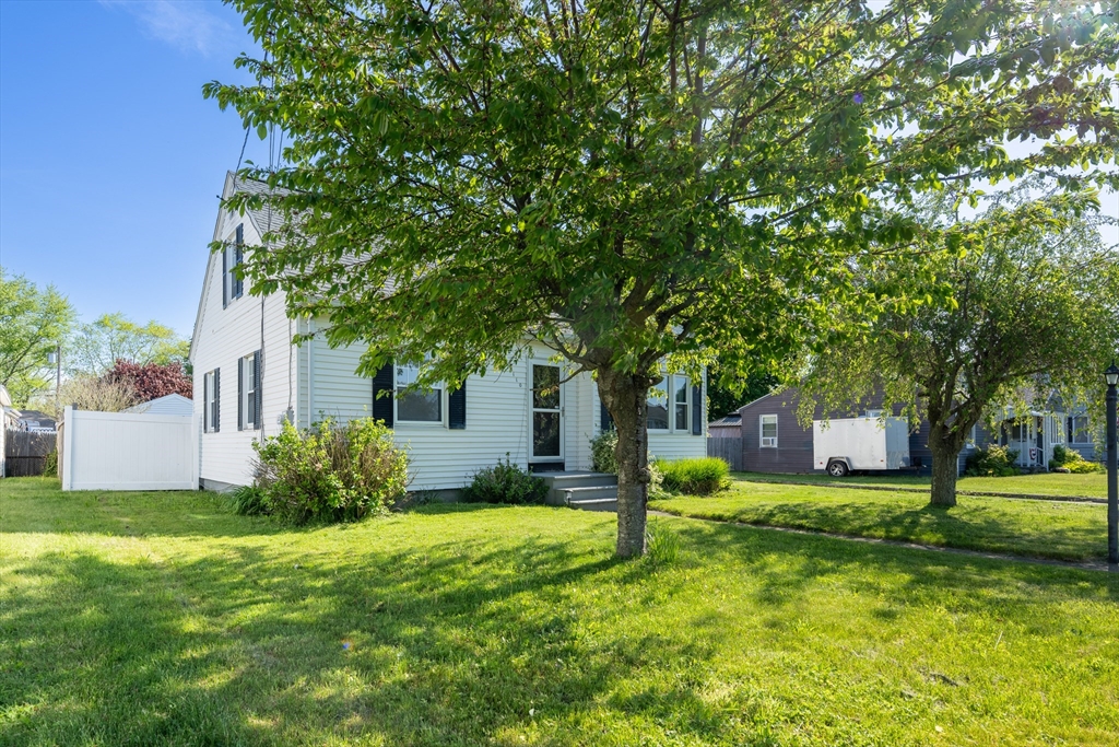 110 James M Beardsworth Road Tiverton, RI 02878 - Photo 25 of 26 a view of a house with a big yard and large trees