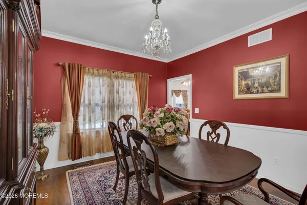 a view of a dining room with furniture window and outside view