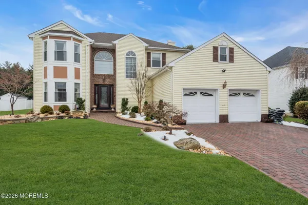 a front view of a house with a yard