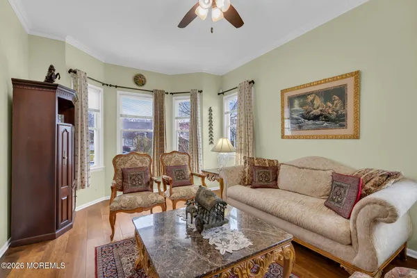 a living room with furniture or couch and a chandelier