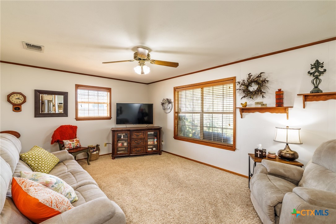 2110 Immenhauser Road Yoakum, TX 77995 - Photo 15 of 39 a living room with furniture and a flat screen tv