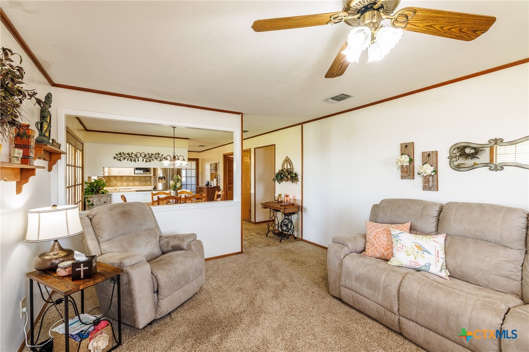 2110 Immenhauser Road Yoakum, TX 77995 - Photo 16 of 39 a living room with furniture and a flat screen tv