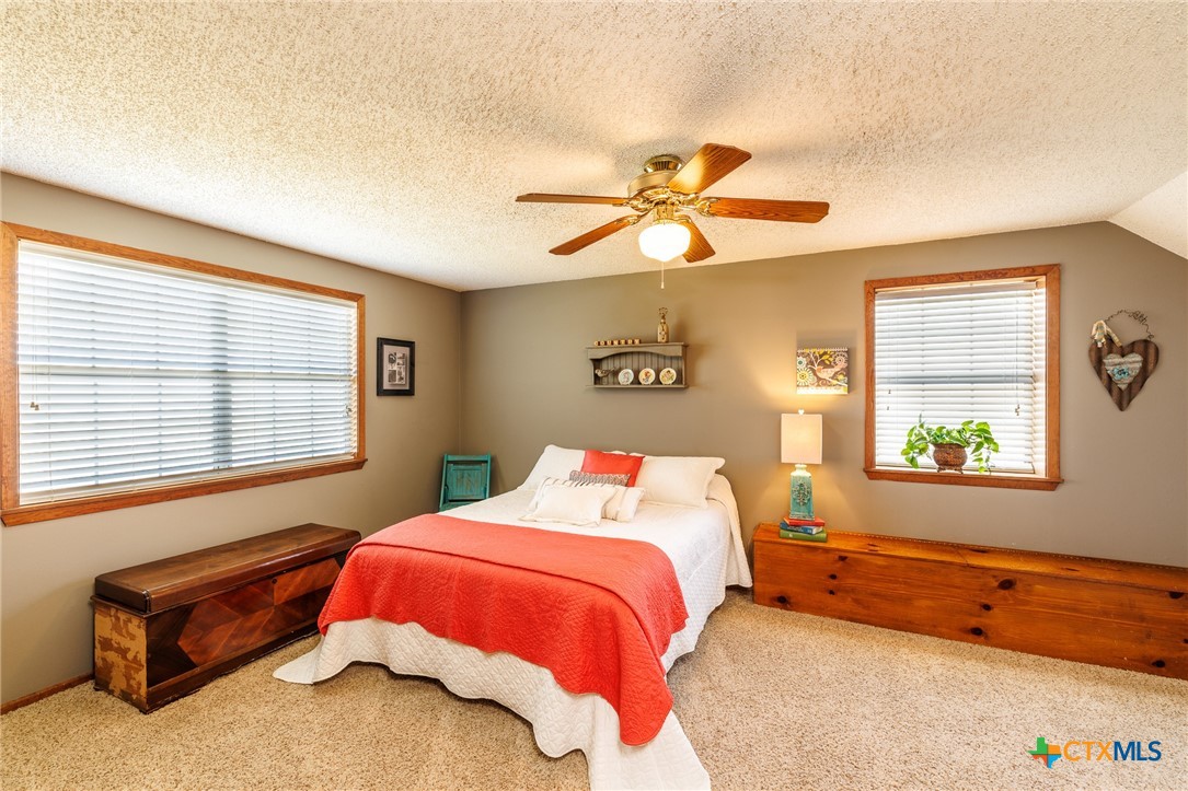 2110 Immenhauser Road Yoakum, TX 77995 - Photo 20 of 39 a bedroom with a bed and a window