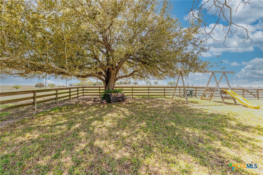 2110 Immenhauser Road Yoakum, TX 77995 - Photo 32 of 39 a view of yard with swimming pool and trees