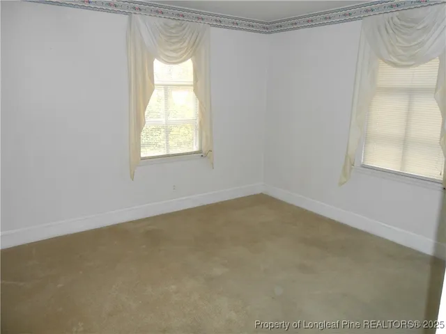 a view of a window in an empty room