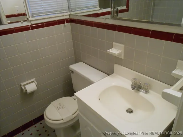 a bathroom with a sink and toilet